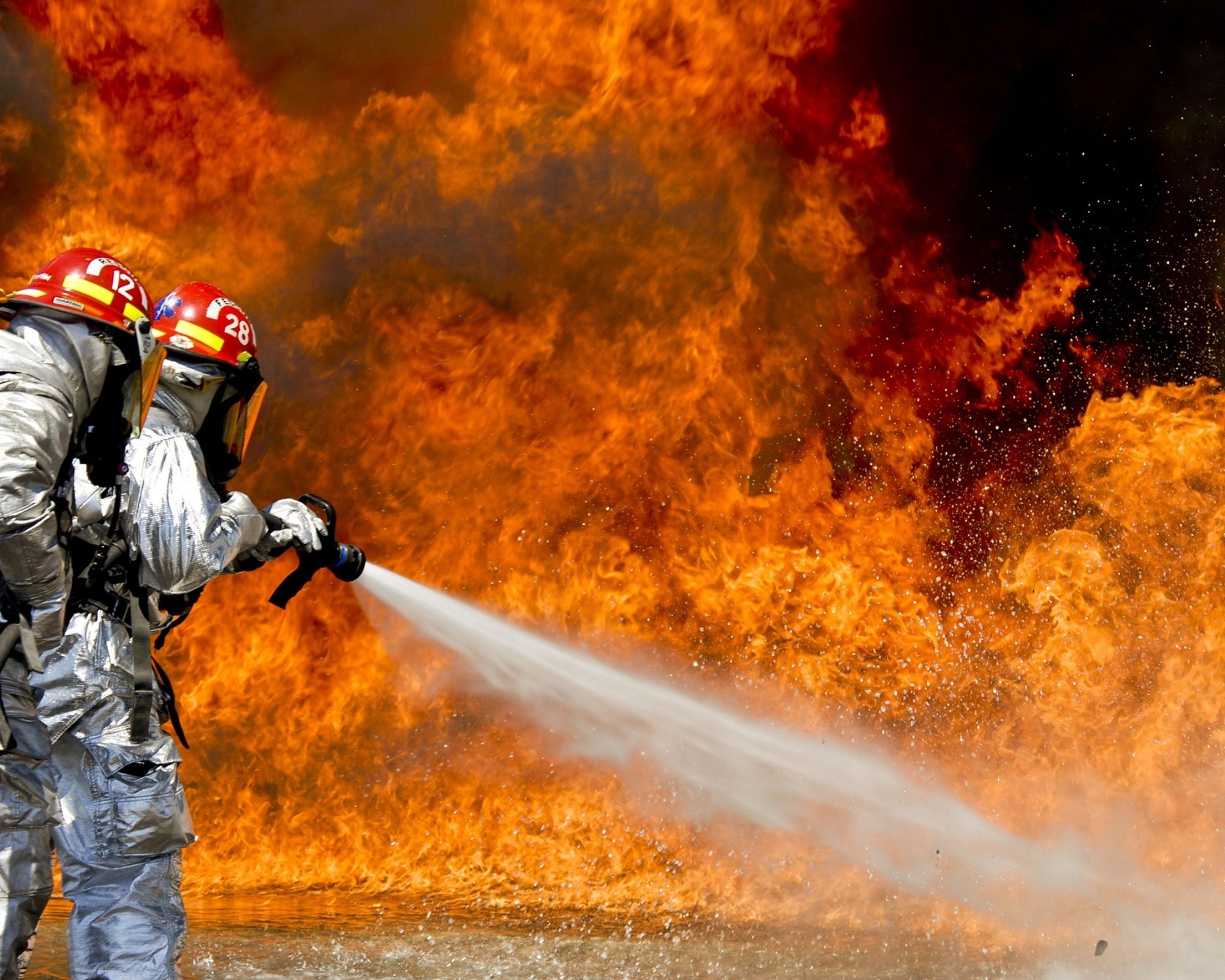 fire fighter using a fire fighting pump